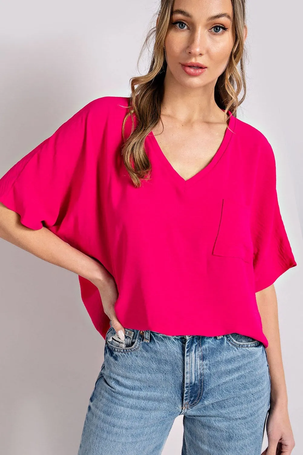 Woven top with V-neckline short sleeves and chest pocket