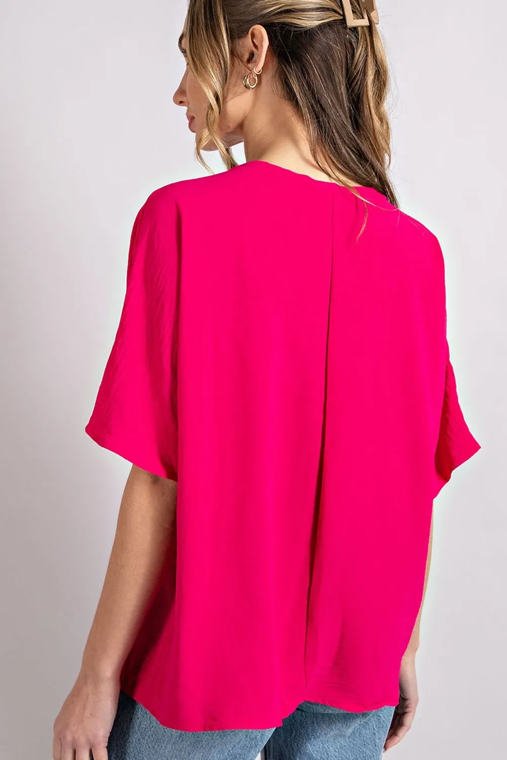 Woven top with V-neckline short sleeves and chest pocket