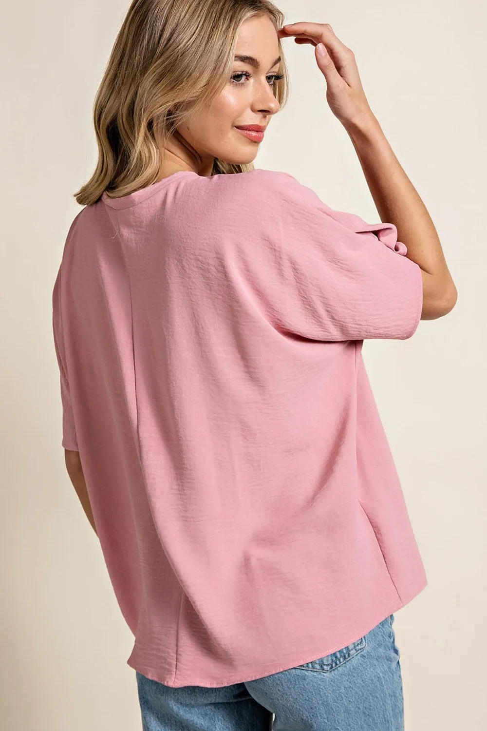 Woven top with V-neckline short sleeves and chest pocket